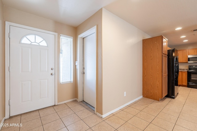 16021 N 30th St Unit 122, Phoenix, AZ 85032 - entrance foyer featuring light tile patterned flooring, healthy amount of natural light, baseboards, and recessed lighting