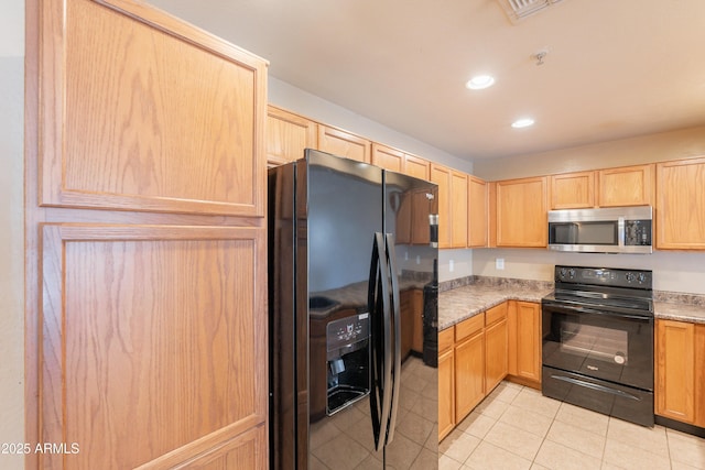 16021 N 30th St Unit 122, Phoenix, AZ 85032 - kitchen with black appliances, light brown cabinetry, recessed lighting, and light tile patterned flooring