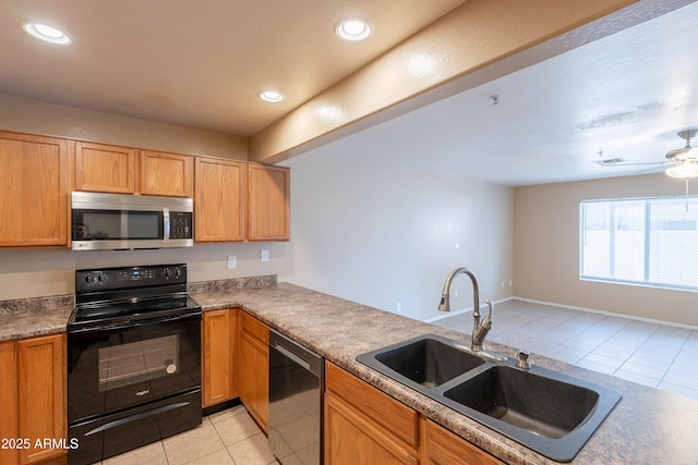 16021 N 30th St Unit 122, Phoenix, AZ 85032 - kitchen featuring black electric range oven, stainless steel microwave, a sink, dishwashing machine, and light tile patterned flooring