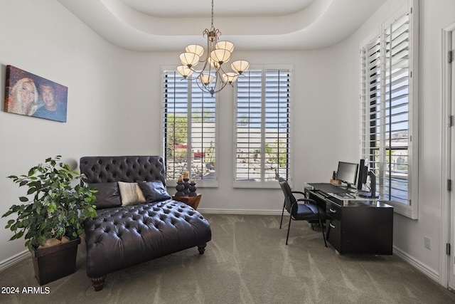 carpeted office space with a notable chandelier and a raised ceiling