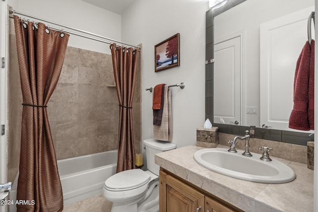 full bathroom featuring shower / tub combo, vanity, and toilet