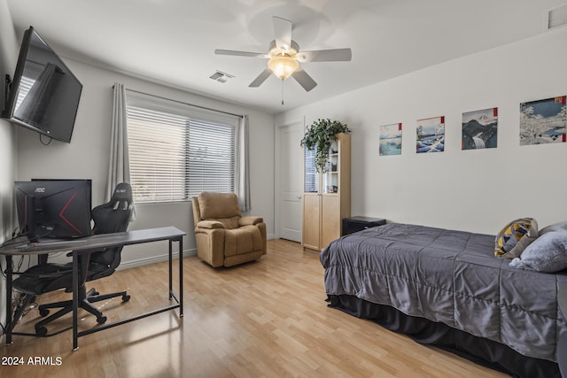 bedroom featuring wood-type flooring and ceiling fan