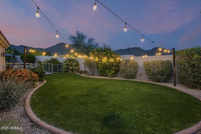 yard at dusk with a mountain view