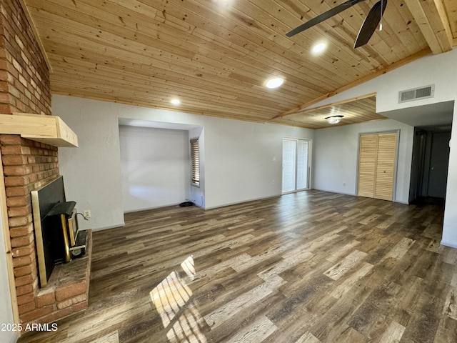 unfurnished living room featuring dark hardwood / wood-style floors, a fireplace, lofted ceiling, ceiling fan, and wood ceiling