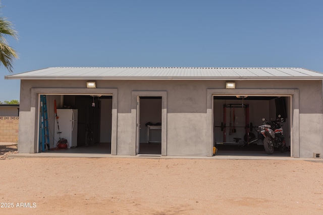 5102 W Whispering Wind Dr, Glendale, AZ 85310 - garage with freestanding refrigerator