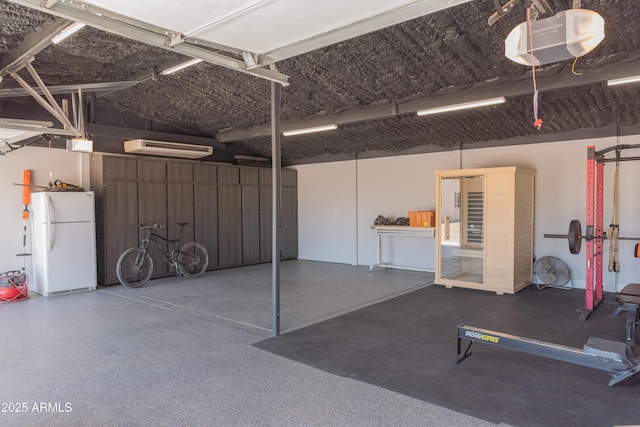 5102 W Whispering Wind Dr, Glendale, AZ 85310 - garage featuring freestanding refrigerator and a garage door opener