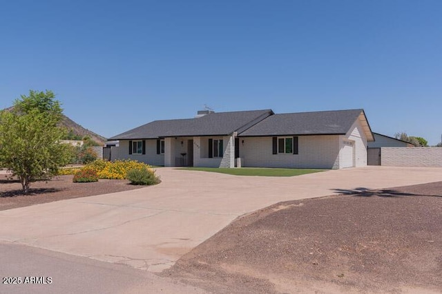 5102 W Whispering Wind Dr, Glendale, AZ 85310 - ranch-style house with curved driveway and a garage