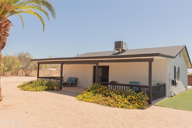 5102 W Whispering Wind Dr, Glendale, AZ 85310 - back of property featuring brick siding and a shingled roof