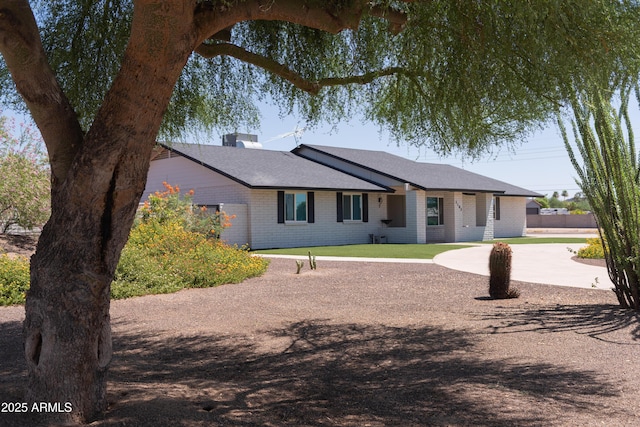 5102 W Whispering Wind Dr, Glendale, AZ 85310 - single story home with brick siding and a chimney