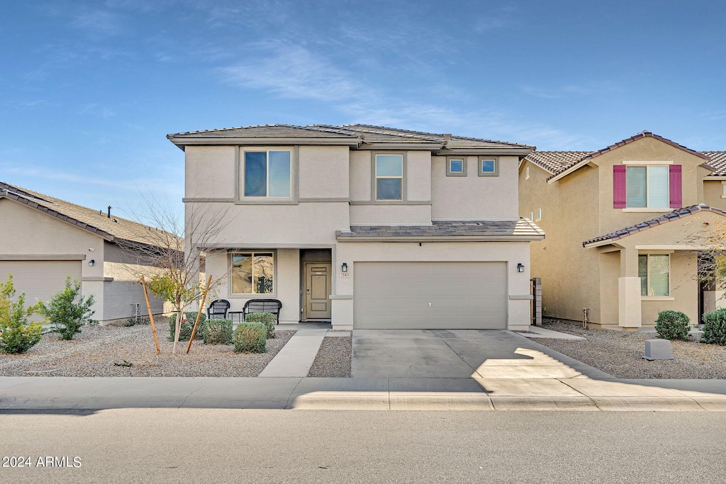 view of front of property with a garage