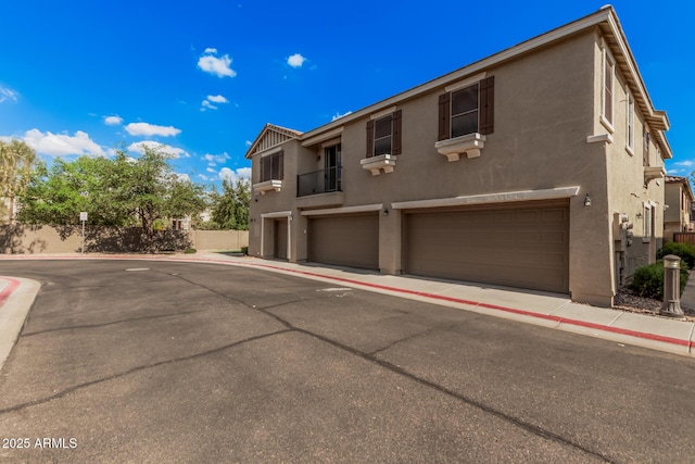 1265 S Aaron Unit 341, Mesa, AZ 85209 - townhome / multi-family property with an attached garage and stucco siding