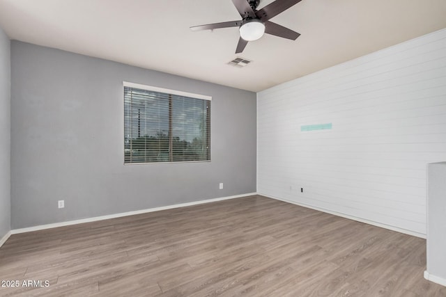 1265 S Aaron Unit 341, Mesa, AZ 85209 - spare room featuring a ceiling fan, wood finished floors, and baseboards