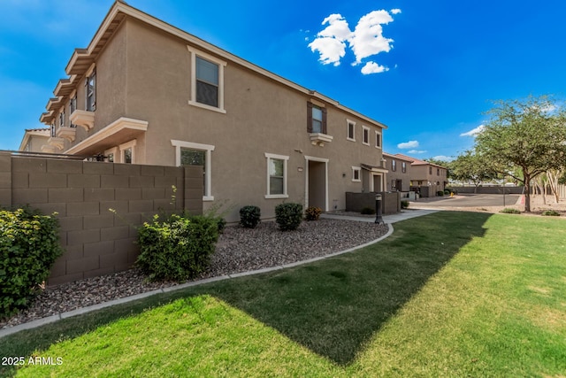 1265 S Aaron Unit 341, Mesa, AZ 85209 - rear view of house featuring stucco siding