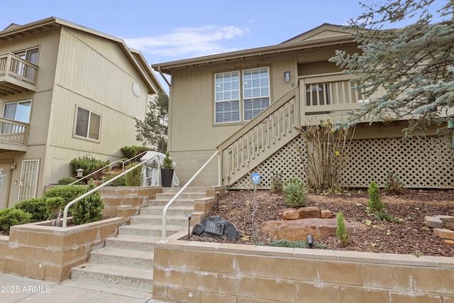 view of front of house featuring stairway