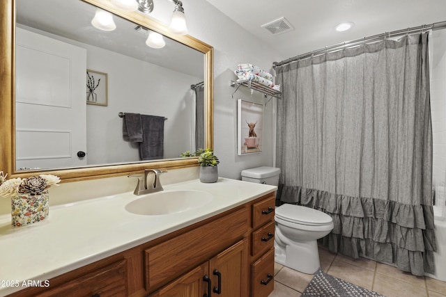 bathroom with curtained shower, visible vents, toilet, vanity, and tile patterned flooring