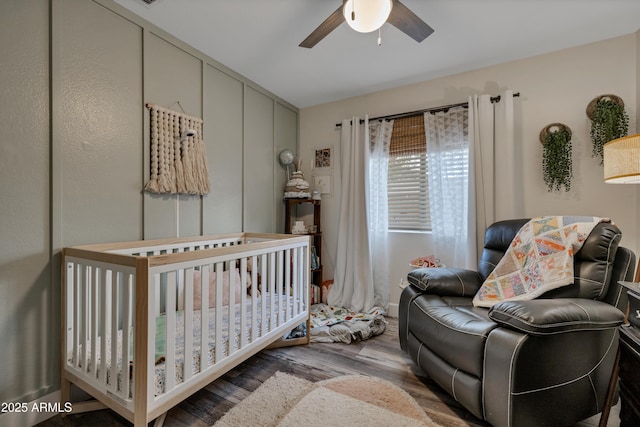 bedroom featuring hardwood / wood-style flooring and ceiling fan