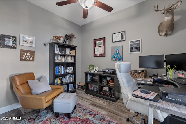 office space with ceiling fan and light wood-type flooring