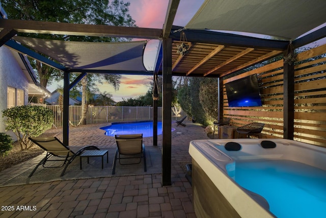 view of patio / terrace with a hot tub