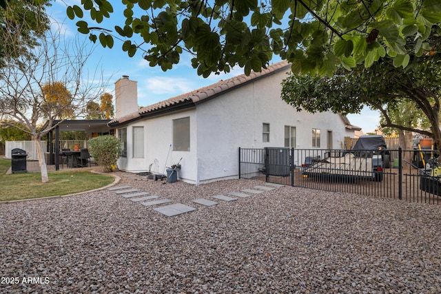 view of side of home featuring a patio area