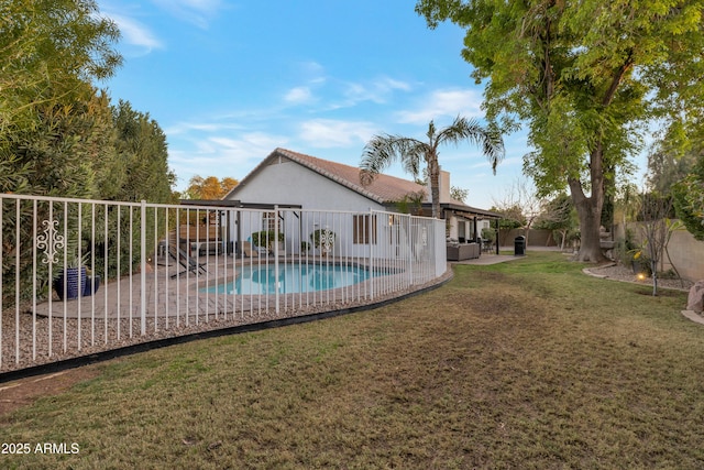 view of swimming pool featuring a yard and a patio area