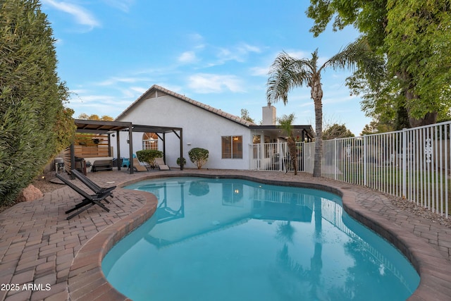 view of swimming pool featuring a patio area