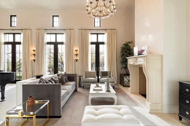 living room featuring ornamental molding, french doors, and a towering ceiling