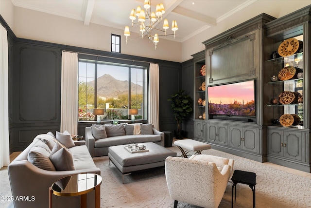 living area with crown molding, a notable chandelier, and beamed ceiling