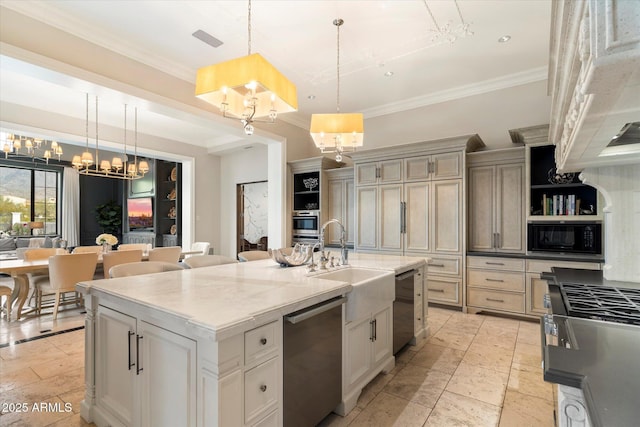 kitchen with a sink, ornamental molding, appliances with stainless steel finishes, open shelves, and a center island with sink