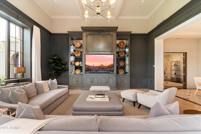 living area featuring a chandelier and ornamental molding