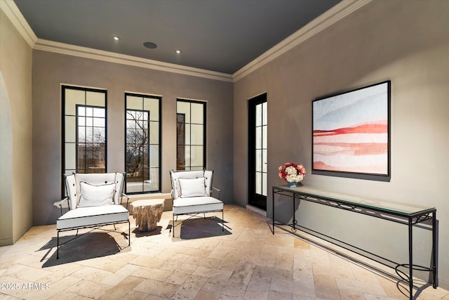 living area with ornamental molding, a healthy amount of sunlight, recessed lighting, and stone tile floors