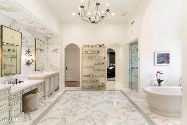 bathroom with marble finish floor, a stall shower, and crown molding