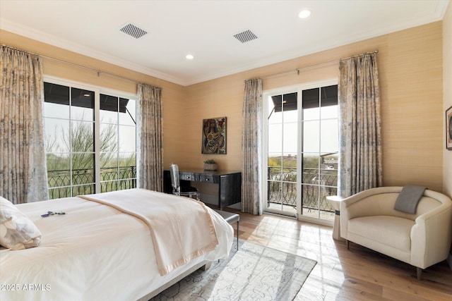 bedroom with access to outside, multiple windows, and visible vents