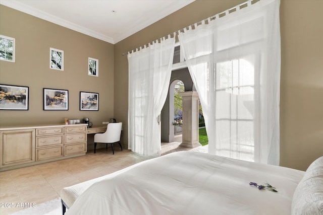 bedroom with light tile patterned floors, built in desk, multiple windows, and crown molding