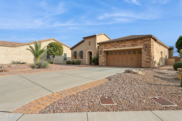 mediterranean / spanish house featuring a garage