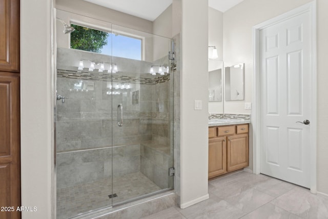 bathroom with walk in shower and vanity