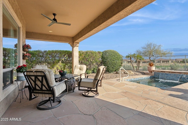 view of patio / terrace with pool water feature and ceiling fan