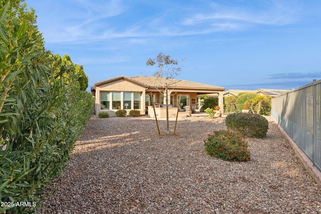 back of house with a patio