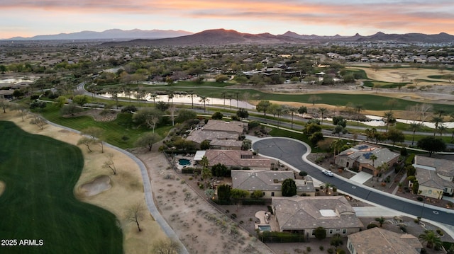 aerial view at dusk with a water and mountain view