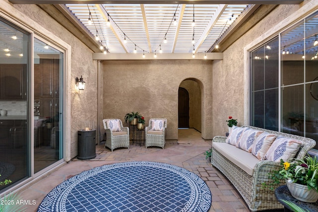 view of patio / terrace featuring outdoor lounge area and a pergola