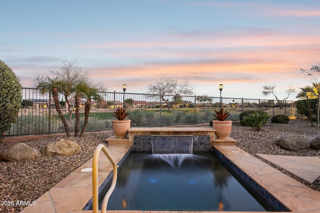 view of patio terrace at dusk