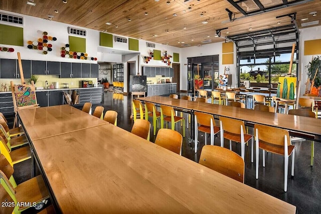 dining room with wood ceiling