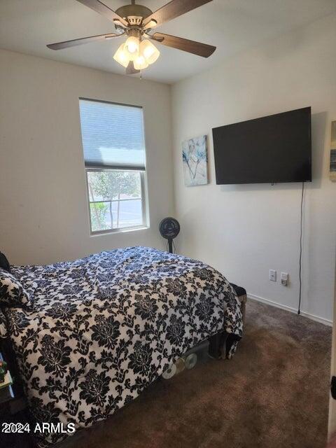 carpeted bedroom featuring ceiling fan