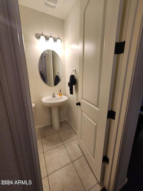 bathroom with tile patterned flooring