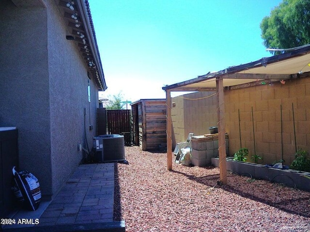 view of yard with central air condition unit