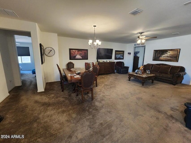 carpeted dining room featuring ceiling fan with notable chandelier