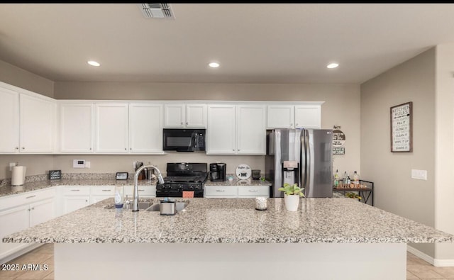3914 S 58th Ln, Phoenix, AZ 85043 - kitchen featuring black appliances, a sink, an island with sink, white cabinets, and recessed lighting