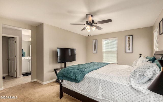 3914 S 58th Ln, Phoenix, AZ 85043 - bedroom featuring light carpet, baseboards, ceiling fan, and ensuite bath