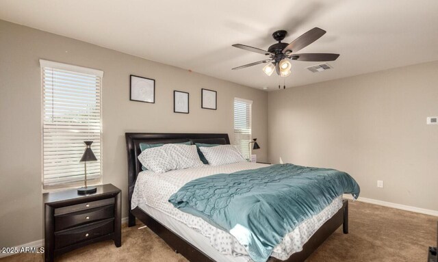 3914 S 58th Ln, Phoenix, AZ 85043 - carpeted bedroom with baseboards and ceiling fan