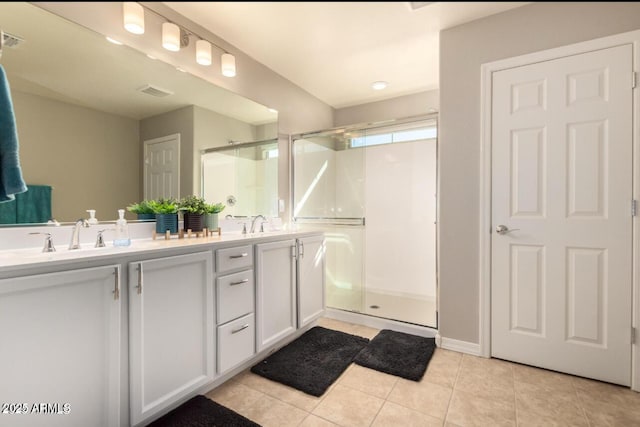 3914 S 58th Ln, Phoenix, AZ 85043 - full bath featuring a shower stall, double vanity, and tile patterned floors