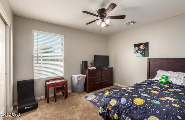 3914 S 58th Ln, Phoenix, AZ 85043 - bedroom with carpet flooring, baseboards, a closet, and a ceiling fan